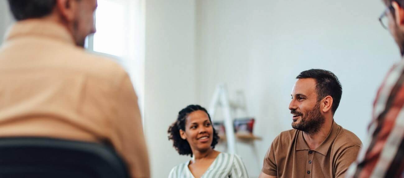 Team of diverse professionals having a discussion in a modern office setting